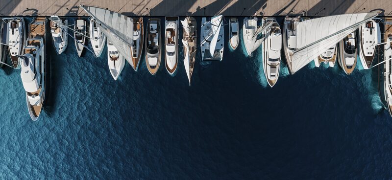 Aerial view of marina with boats and wharf infrastructure